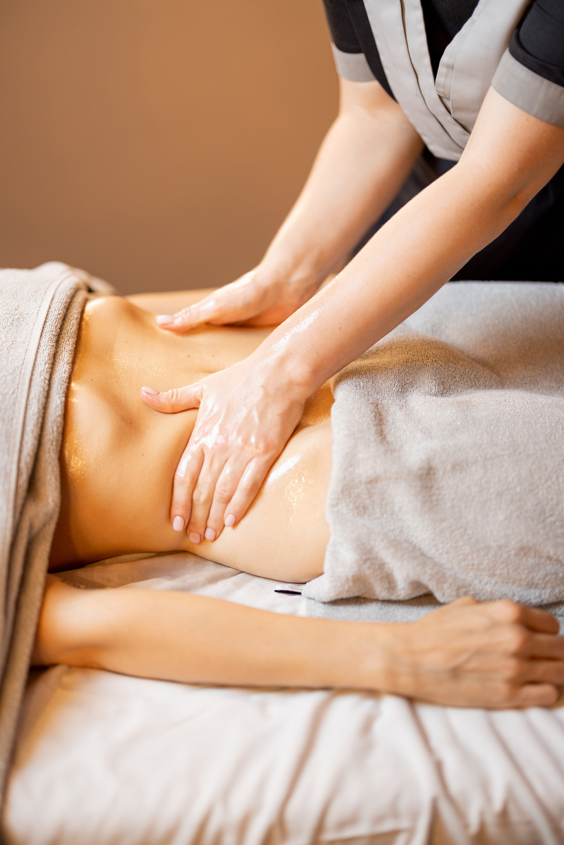 Masseuse Performs Professional Abdominal Massage
